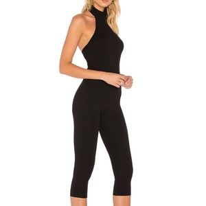 Chic black halter jumpsuit with 3/4 crop legs